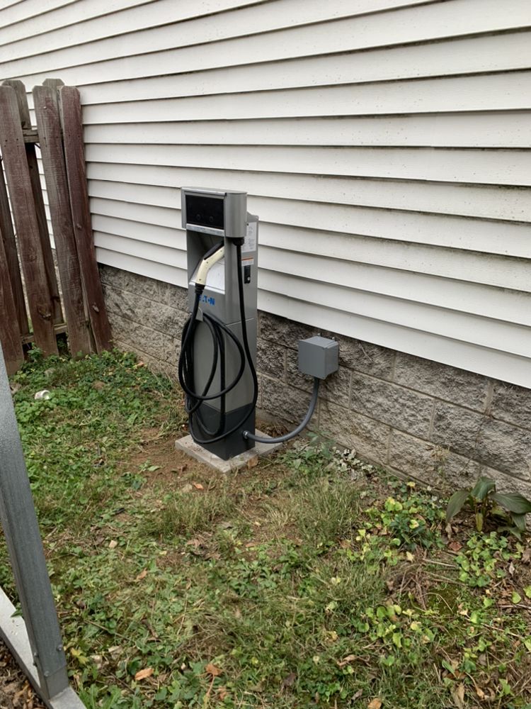 Residential EV charger installed beside a home